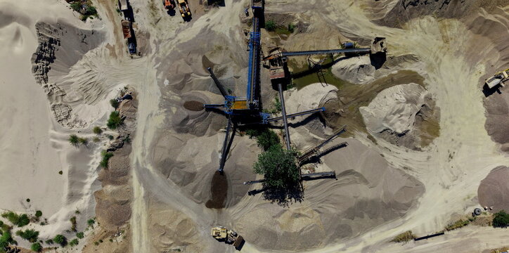 Aerial view of gravel pits and sand excavation site with heavy machinery, conveyor belts, and piles of aggregate in Belgrade, City of Belgrade, Serbia.