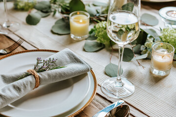 Elegant table setting with wine and candles