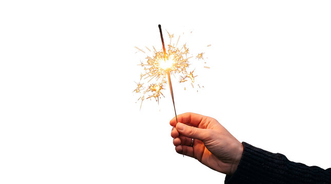 Hand holding a lit sparkler with bright sparks against a white background isolated on white background