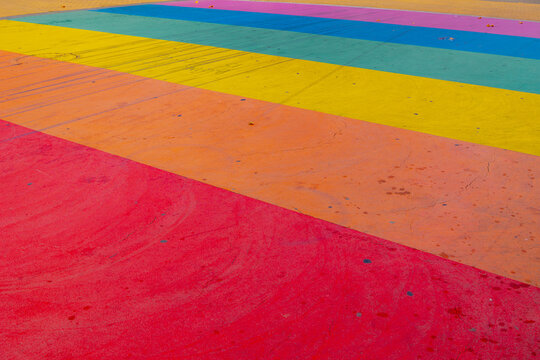 Worldwide LGBTQ community concept, Celebration of the pride month, Rainbow pedestrian crosswalk, Low angle of crossroad, The symbolic of Gay, Lesbian, Bisexual, Transgender and Queer, Social movements