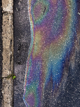 Rainbow oil slick asphalt texture