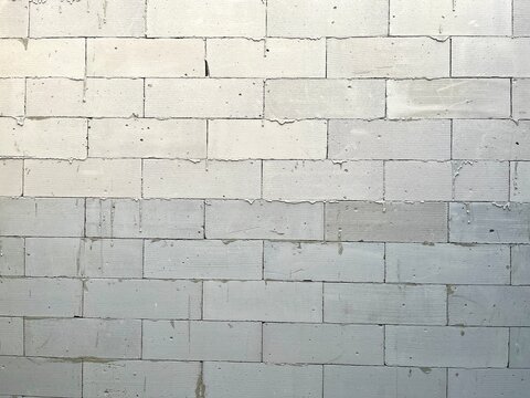 ​White light weight concrete block wall texture background for industrial and construction design concepts