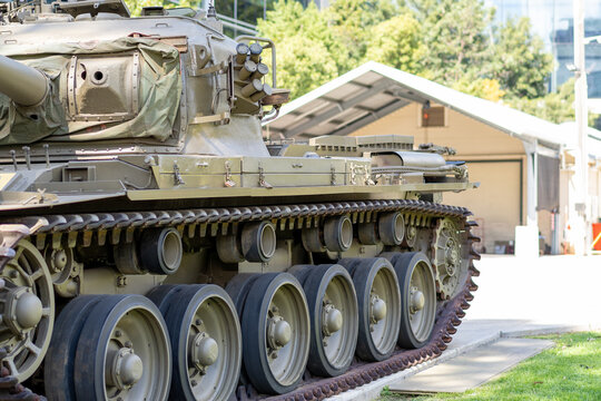 Side profile of historic military tank showing continuous tracks and turret