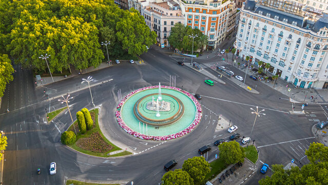 Neptune Fountain and Plaza de Canovas del Castillo at Sunset in Madrid