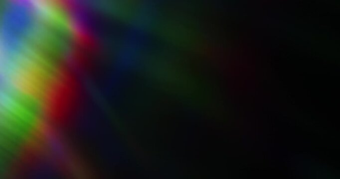 Lights shining into a prism causing an optical effect of a brilliant rainbow of dancing light rays. Light reflect creating a visual of a dreamy burst of light shining and sparkling. Seamless Loop.