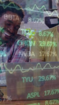 Animation of stock market data processing over diverse colleagues smiling while looking at laptop