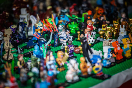 BELGRADE, SERBIA - JULY 11, 2026: Assorted Lego figurines and toy characters are arranged for sale on a market stall in Belgrade, with mini figures, sports themes and fantasy characters.
