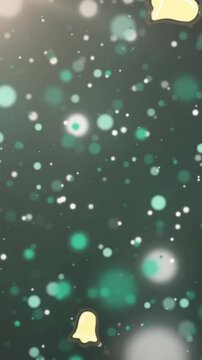 Animation of christmas bell icons falling against spots of light on blue background with copy space