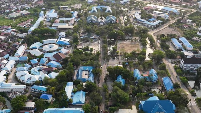 Drone view of schools and lush trees in Banjarmasin, South Kalimantan, Indonesia