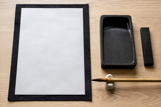 Japanese calligraphy tools with inkstone brush and blank paper