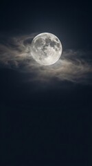 Fototapeta premium Majestic full moon illuminated against a dramatic dark sky, peeking through wispy, atmospheric clouds, showcasing the serene beauty of the nocturnal heavens