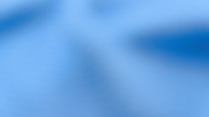 Fototapeta premium Abstract soft blue fabric texture background with gentle light and shadow. Clean smooth cloth for commercial design, medical, and corporate themes.