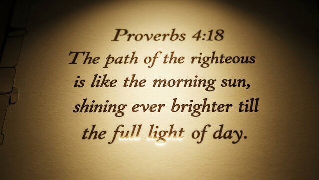 Open bible with highlighted verse proverbs 4:18 on aged parchment background scripture page golden text