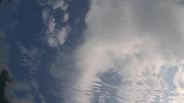 Slow motion underwater view of sunlight rippling on the sea surface, Cote d'Azur, France
