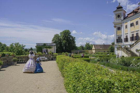 Woman with child in historic clothes at the castle, Milotice u Kyjova, South Moravian Region, Czech Republic