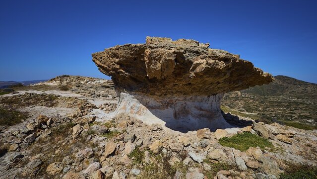 Natural rock formation rises majestically against blue sky, mushroom rock, mushroom rock, bizarre rock, rock formation, Skiadi, Kimolos, Cyclades, Greek Islands, Greece