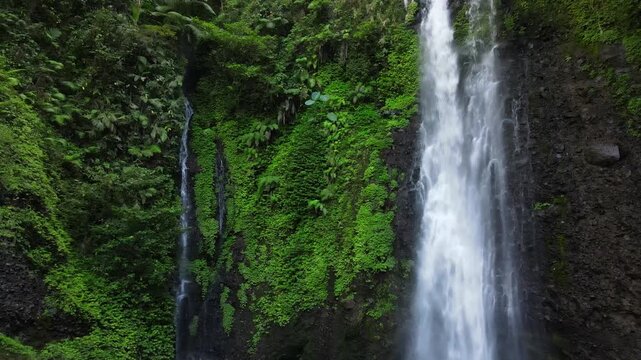Aerial Scenery of Cidadap Waterfall Hidden in a Tropical Forest with Pristine Waters and Various Wild Trees During Morning in Indonesia.