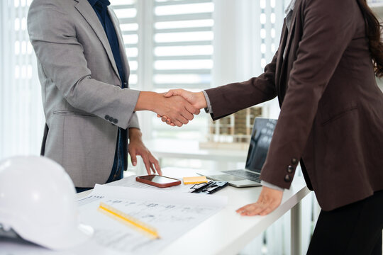 Engineer or architect meeting for project, Handshaking after consultation and conference new project plan, deal contract .  Meeting and greeting, success, partnership.