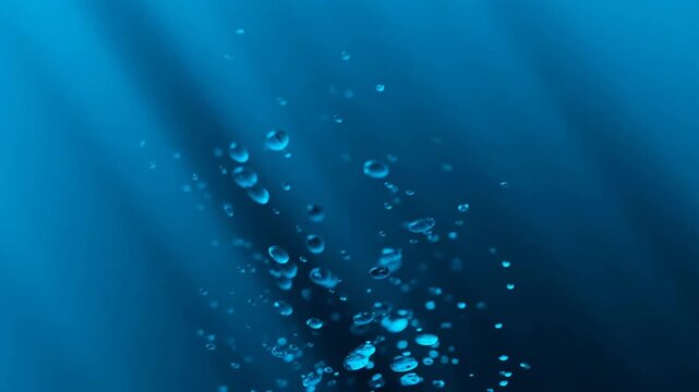 Bubbles rising gracefully through water against a deep blue background with soft light rays creating a serene and captivating underwater effect.