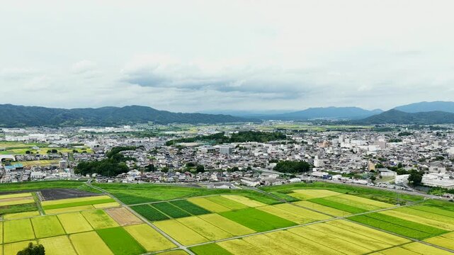 Aerial drone footage over rural town and farmland in Iga, Mie, Japan