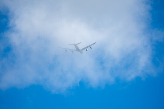 Etihad Airbus A380 Disappearing into a Dense Cloud