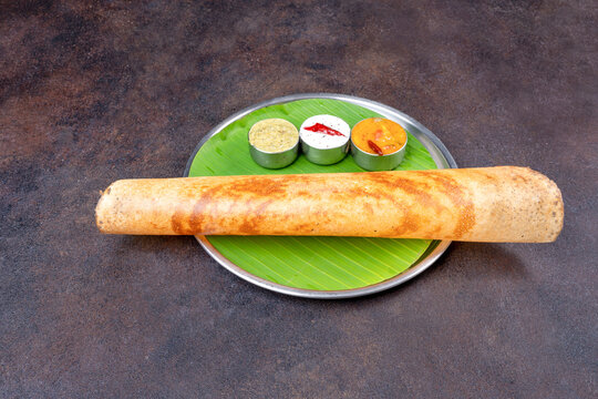 Traditional South Indian dosa with colorful chutneys