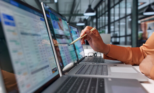 Financial Analyst Reviews Cloud Cost Data On Laptop