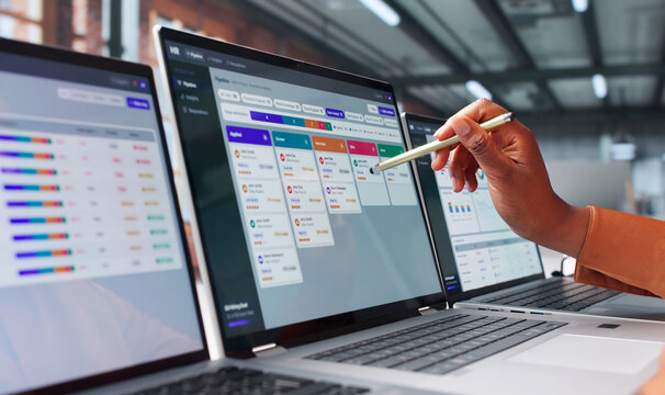 Human Resources Manager Reviews Candidate Profiles Using Laptop