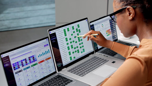 Risk Manager Studies Compliance Dashboard On Laptop