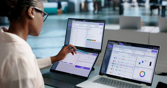 Sales Manager Analyzes Dual Touchscreen Laptop For Commission