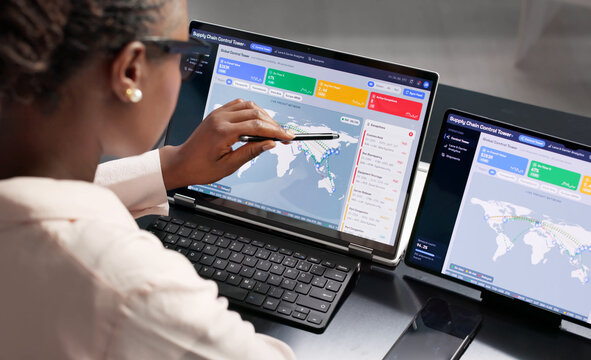 Supply Chain Manager Monitors Global Shipments