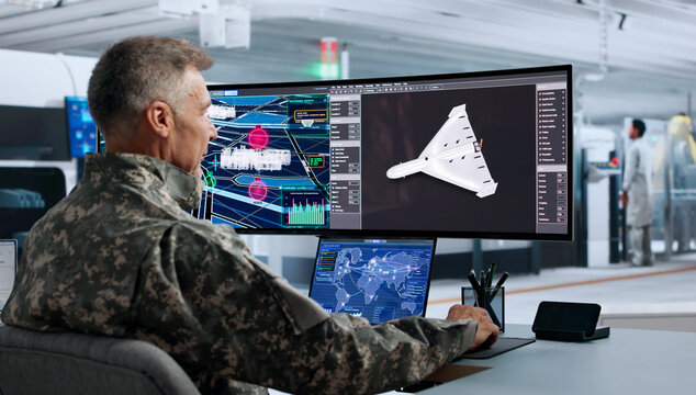 Engineer Focuses Intently While Designing Autonomous Military Drone