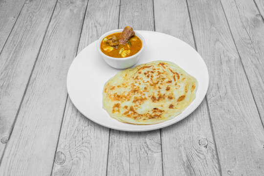 South Indian parotta served with non vegetarian kurma