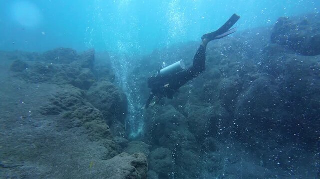 Weh Island, Indonesia : Footage of diver swims toward bubbles in underwater volcano. also known as hot spring dive site, in Weh Island of Sabang in Aceh, Indonesia