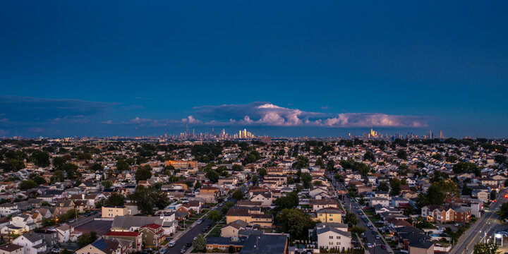 Aerial panorama of Lyndhurst New Jersey suburban neighborhood at twilight with New York City skyline