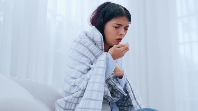Asian woman with asthma and a cough sleeps under a blanket, has breathing difficulties in the living room, experiences chest pain, a sore throat, and tuberculosis, along with allergies