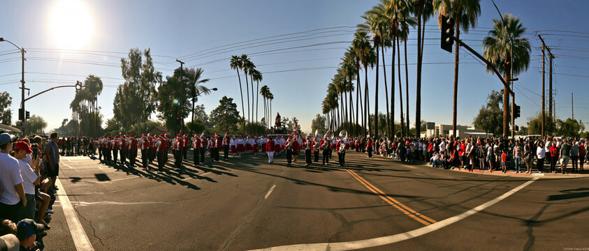 Christmas parade with marching band and floats in the city