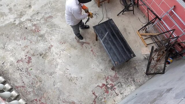 Welder Putting On Protective Work Gloves Before Welding Task