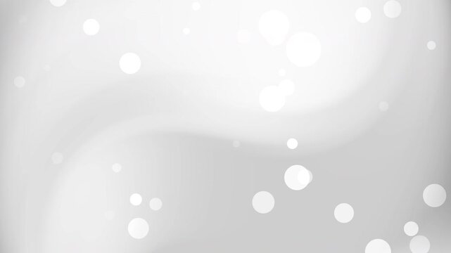 abstract white and grey gradient background circles against soft grey abstract background for use as a bright bokeh effect backdrop in design projects.