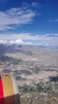 Ladakh, India : Aerial footage from plane flying above Indus valley in Leh of Ladakh, India showing beautiful landscape of indus river and Himalayan mountain ranges