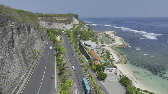 Aerial view of road across Melasti beach and cliff in Bali island, Indonesia