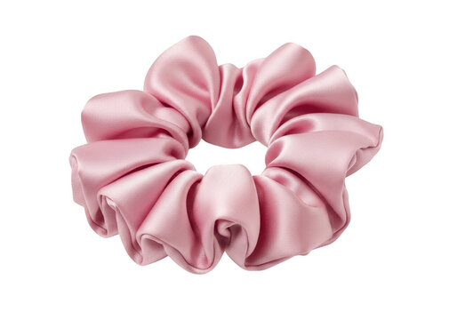 A soft pink satin hair scrunchie accessory for styling women hair in a simple elegant fashion isolated on transparent background