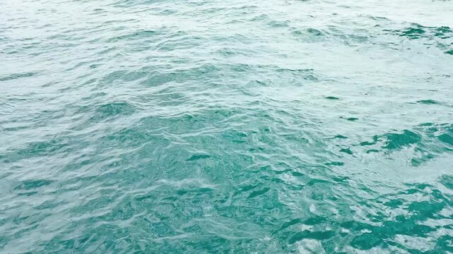 Turquoise ripple water reflection in tropical beach. Blue ocean waves. Summer sea. Waves in motion