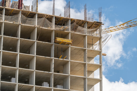 Construction site showcasing a high-rise building reaching for the sky