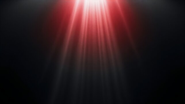 Bright red light rays shining from above on dark background with red glow abstract background black backdrop