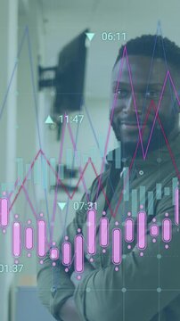 Animation of statistical data processing against portrait of african american man smiling at office