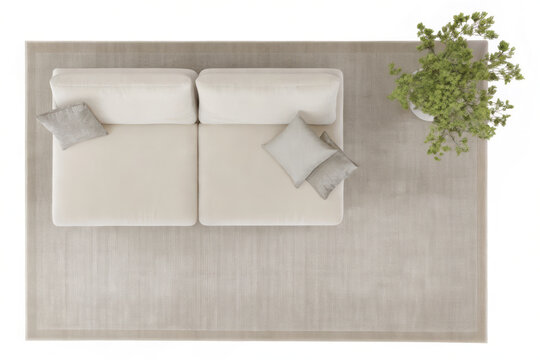View of a cream sectional sofa with light gray throw pillows on a beige rug next to a potted green plant