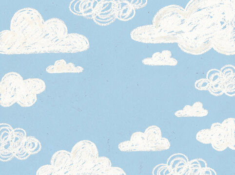 Hand drawn white clouds on light blue sky background