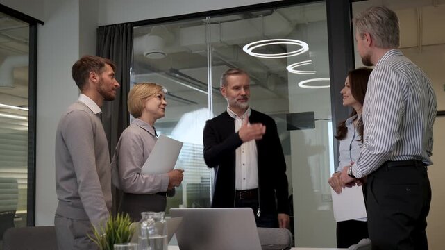 Business people shaking hands, finishing up a meeting