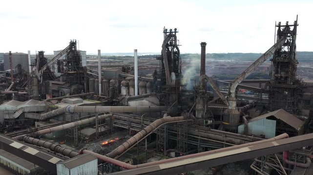Scunthorpe Steelworks and its blast furnaces in North Lincolnshire, England, with large-scale steelmaking plant, chimneys and heavy industrial infrastructure.